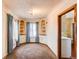 Charming dining room with built-in corner cabinets and hardwood floors at 2600 S Downing St, Denver, CO 80210