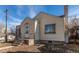 Tan house with a front porch and yard at 2600 S Downing St, Denver, CO 80210