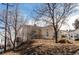 House on a hill with a yard and trees at 2600 S Downing St, Denver, CO 80210