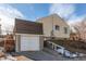 Detached garage with a white door and steps at 2600 S Downing St, Denver, CO 80210