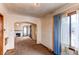 Bright living room features a fireplace and an arched doorway at 2600 S Downing St, Denver, CO 80210