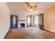 Living room with fireplace and light blue curtains at 2600 S Downing St, Denver, CO 80210