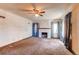 Living room with fireplace and light blue curtains at 2600 S Downing St, Denver, CO 80210