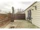 Small concrete patio area with wooden fence at 2600 S Downing St, Denver, CO 80210