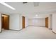 Finished basement with neutral carpet and paint featuring two closets and a window at 3079 E Long S Cir, Centennial, CO 80122