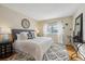 Cozy bedroom features a well-lit window and neutral decor at 3079 E Long S Cir, Centennial, CO 80122