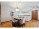 Cozy dining room with hardwood floors and a stylish chandelier offers a warm setting at 3079 E Long S Cir, Centennial, CO 80122