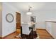 Bright dining room with hardwood floors and a modern chandelier creates an inviting space at 3079 E Long S Cir, Centennial, CO 80122