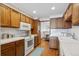 Well-lit kitchen with white countertops and ample storage cabinets provides practical features at 3079 E Long S Cir, Centennial, CO 80122