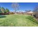 Large backyard with mature trees and a wooden fence providing privacy and security at 1342 S Andes St, Aurora, CO 80017