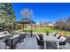 Backyard features a large seating area, a gazebo, and plenty of green space at 1342 S Andes St, Aurora, CO 80017