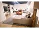 Cozy basement area with a comfortable couch, rug, chair, tv, and workout bike at 1342 S Andes St, Aurora, CO 80017