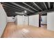 Basement with modern lighting, a light-colored floor, and white dividing walls at 1342 S Andes St, Aurora, CO 80017