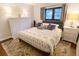 Cozy bedroom featuring neutral walls, plush bedding, decorative touches, and natural light at 1342 S Andes St, Aurora, CO 80017