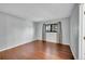 Clean bedroom with hardwood floors, natural light, neutral walls, and black framed windows at 1342 S Andes St, Aurora, CO 80017