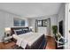 Relaxing bedroom with an upholstered bed, stylish nightstands, art and a comfortable rug at 1342 S Andes St, Aurora, CO 80017