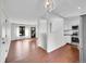 Open-concept living area featuring hardwood floors, natural light, and seamless flow into the kitchen at 1342 S Andes St, Aurora, CO 80017