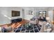 Comfortable living room with modern decor, stylish rug, and a large screen television for entertaining at 1342 S Andes St, Aurora, CO 80017