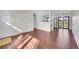 Bright living room featuring hardwood floors and natural light near the kitchen and sliding glass door at 1342 S Andes St, Aurora, CO 80017