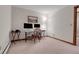 This bedroom features an office space with dual monitors and a cozy chair at 4863 Silver Spruce Ln, Evergreen, CO 80439