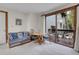 Comfortable living room with a sliding glass door that provides access to the deck and natural light at 4863 Silver Spruce Ln, Evergreen, CO 80439
