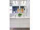 Modern bathroom featuring double sinks, a floating vanity, and stylish fixtures at 260 S Jasmine St, Denver, CO 80224