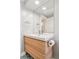 Bathroom vanity featuring wood cabinets, a square sink, and a frameless mirror at 260 S Jasmine St, Denver, CO 80224