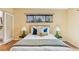 Serene bedroom featuring a comfortable bed, stylish lamps, and ample natural light at 260 S Jasmine St, Denver, CO 80224