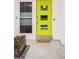Inviting front door with a vibrant color, complemented by a stylish flower box and decorative pebbles at 260 S Jasmine St, Denver, CO 80224