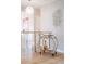 Stylish hallway featuring hardwood floors, modern art, and a functional bar cart at 260 S Jasmine St, Denver, CO 80224