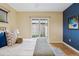 Comfortable main bedroom with a sliding glass door and natural light at 260 S Jasmine St, Denver, CO 80224