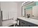 Bright bathroom featuring gray vanity, modern fixtures and painted walls at 6839 Zenobia St # 3, Westminster, CO 80030