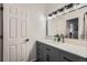 Modern bathroom with gray vanity, modern fixtures, and painted walls at 6839 Zenobia St # 3, Westminster, CO 80030