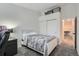 Neat bedroom, carpeted, with lots of storage and natural light through window at 6839 Zenobia St # 3, Westminster, CO 80030