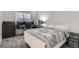 Comfortable carpeted bedroom with neutral colors and natural light throughout at 6839 Zenobia St # 3, Westminster, CO 80030