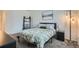 Inviting bedroom with soft carpet and calming decor with natural light through a window at 6839 Zenobia St # 3, Westminster, CO 80030