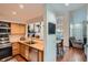 Well-appointed kitchen flows to the living space, offering a breakfast bar and stainless appliances at 6839 Zenobia St # 3, Westminster, CO 80030