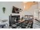 Relaxing living room area showcasing a cozy couch, accent furniture, high ceilings, and a staircase at 6839 Zenobia St # 3, Westminster, CO 80030