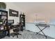 Comfortable office space with desk, chair, and shelving at 6839 Zenobia St # 3, Westminster, CO 80030