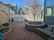 Secluded brick patio with a stone fire pit, perfect for outdoor gatherings and relaxation at 12453 Knox Ct, Broomfield, CO 80020