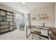 Bright bedroom features a desk, bookcase, and neutral decor at 12453 Knox Ct, Broomfield, CO 80020