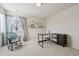 Bright bedroom features a rocking chair, desk, and neutral decor at 12453 Knox Ct, Broomfield, CO 80020