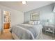 Cozy bedroom features a double bed, light blue accent wall and decor at 12453 Knox Ct, Broomfield, CO 80020