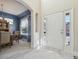 Bright foyer with light wood-look floors, a white front door and dining room views at 12453 Knox Ct, Broomfield, CO 80020