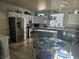 Modern kitchen with stainless steel appliances, an island, and a dining area at 12453 Knox Ct, Broomfield, CO 80020