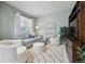 Cozy living room featuring neutral paint, a plush rug, comfortable seating, and natural light at 12453 Knox Ct, Broomfield, CO 80020