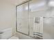 Bathroom shower features a sliding glass door, towel rack and white tile at 12453 Knox Ct, Broomfield, CO 80020