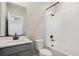 Bathroom with modern fixtures, white subway tile, and quartz countertops at 18338 E 93Rd Pl, Commerce City, CO 80022