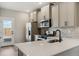 Modern kitchen featuring stainless steel appliances, sleek countertops, and lots of cabinet space at 18338 E 93Rd Pl, Commerce City, CO 80022