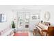 Bright basement area featuring a piano, seating and stylish decor with walk out access at 3884 Osceola St, Denver, CO 80212